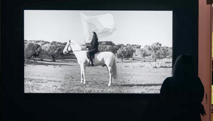 Moco Museum Amsterdam The Hero with visitors in front of modern art installation.