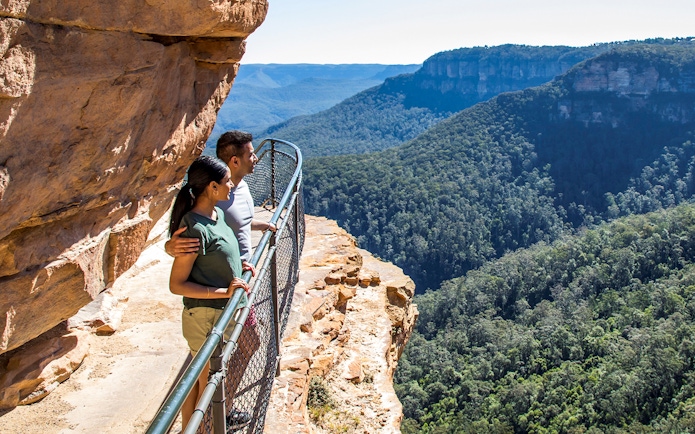 Couple enjoying Jamison Valley view on Blue Mountains day trip from Sydney.