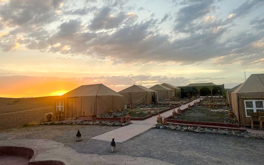 Marrakesh desert camp tents at sunset in Agafay.
