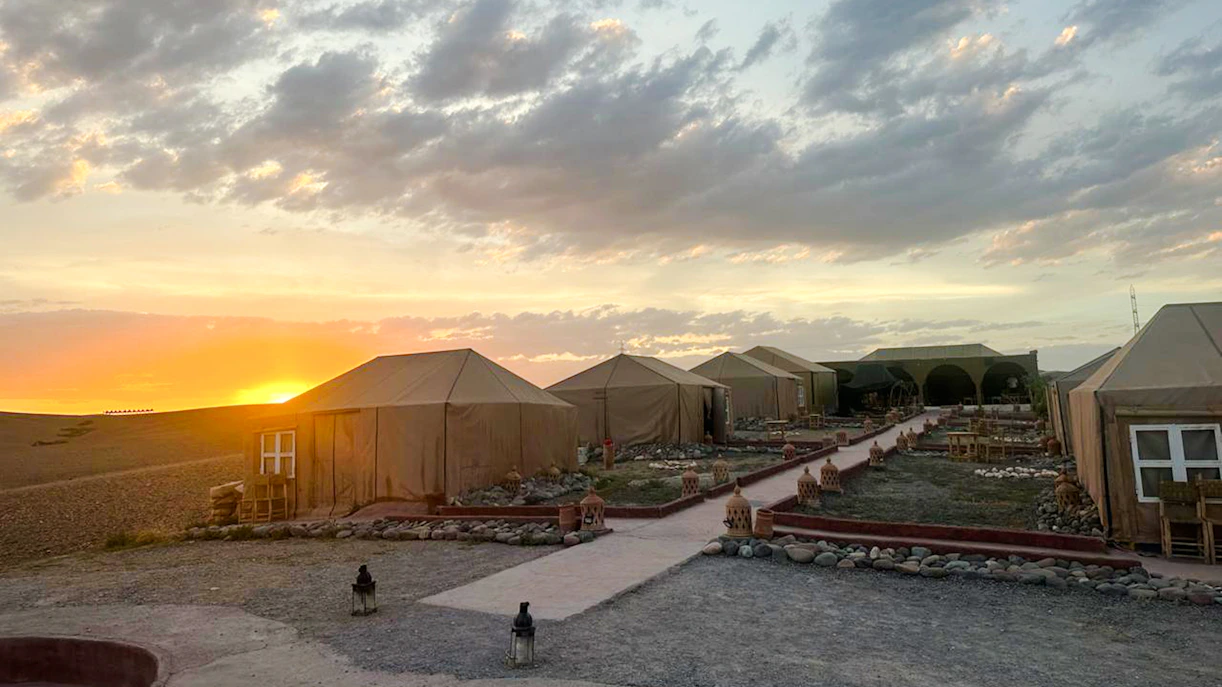 Marrakesh desert camp tents at sunset in Agafay.