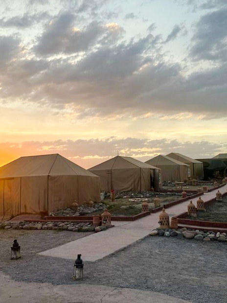 Marrakesh desert camp tents at sunset in Agafay.