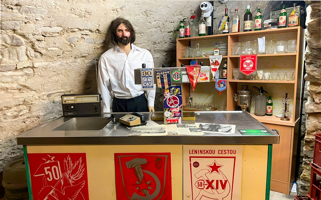 Prague Beer Museum interior with vintage bar setup and memorabilia.