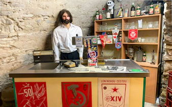 Prague Beer Museum interior with vintage bar setup and memorabilia.