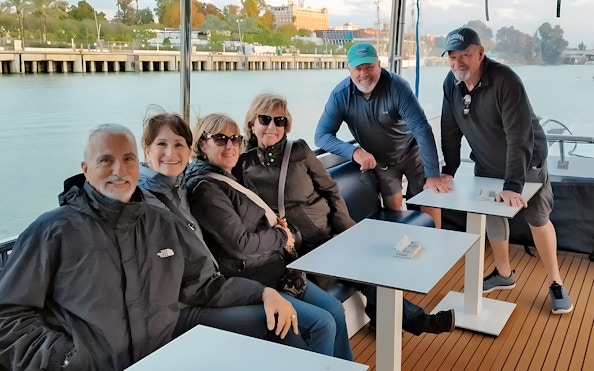 Tourists enjoying a Seville Guadalquivir River sightseeing cruise.