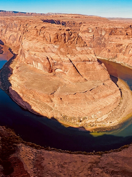 Horseshoe Bend aerial view with Colorado River, part of helicopter tour.