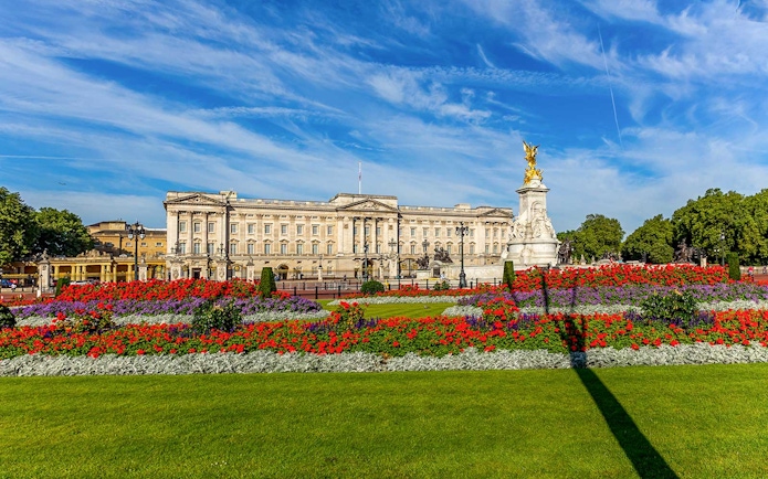 Buckingham Palace with vibrant gardens, part of BigBus London tour.