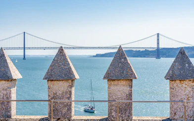 Belem Tower terrace view of Tagus River and bridge in Lisbon, Portugal.