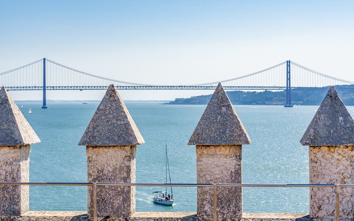 Belem Tower terrace view of Tagus River and bridge in Lisbon, Portugal.