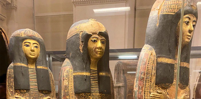 Ancient Egyptian sarcophagi on display at the Louvre Museum.