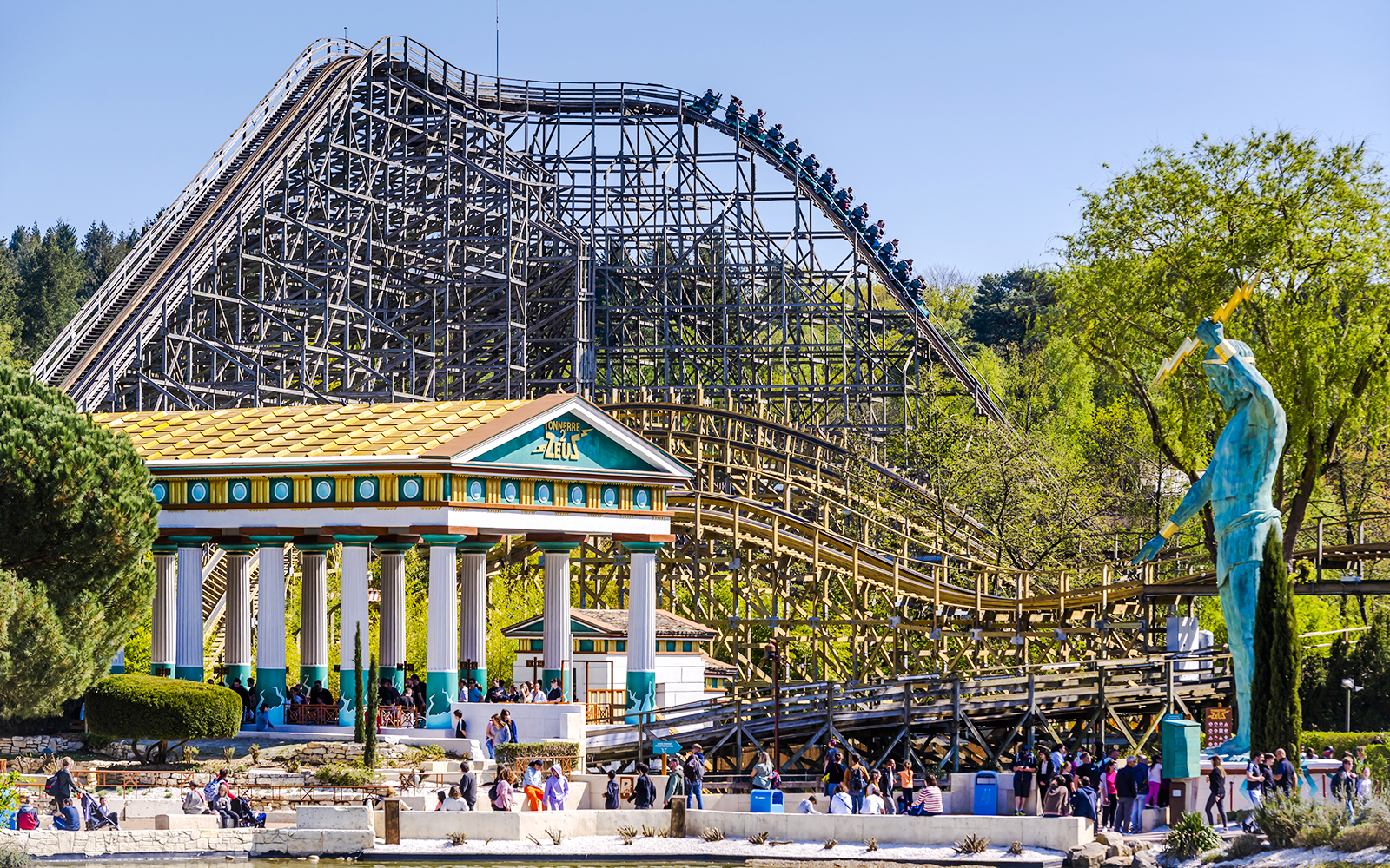 Roller coaster and Greek temple at Parc Asterix, France.