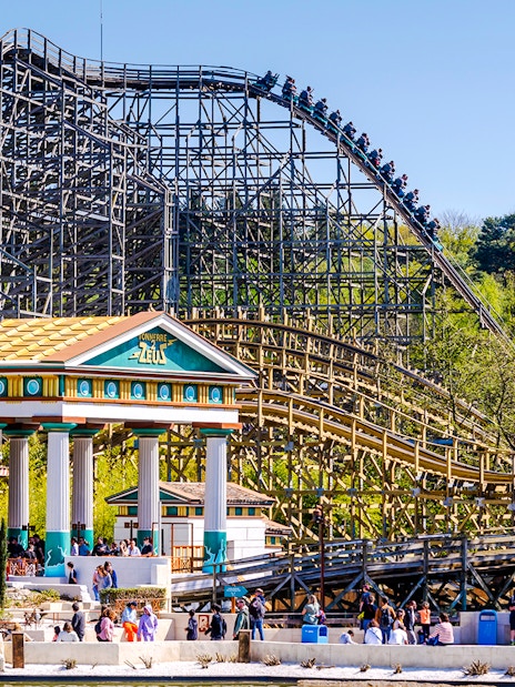 Roller coaster and Greek temple at Parc Asterix, France.