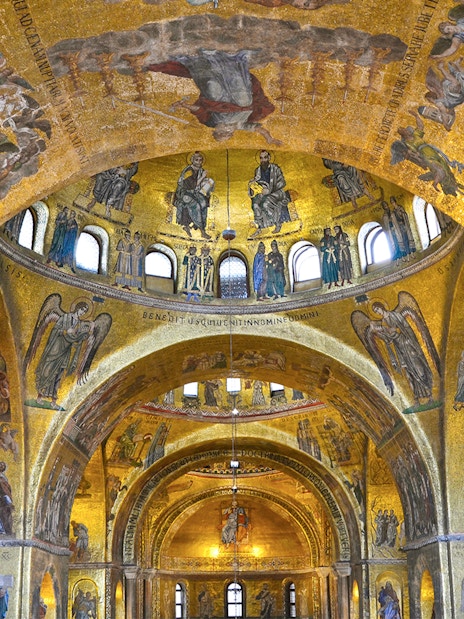 Interior mosaics of St Mark's Basilica, Venice, Italy, depicting religious scenes and figures.