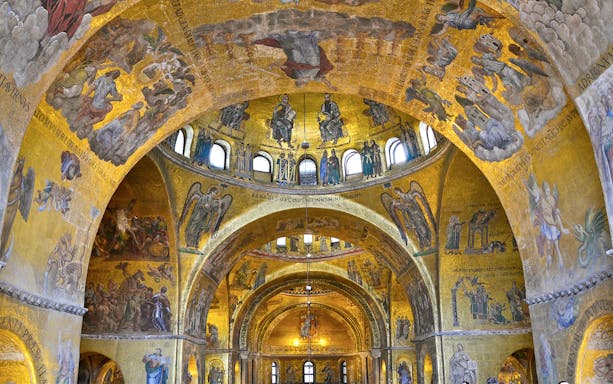 Interior mosaics of St Mark's Basilica, Venice, Italy, depicting religious scenes and figures.