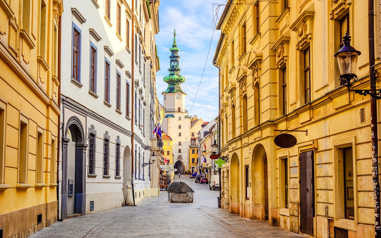 Michael's Gate in Bratislava's Old Town, Slovakia, with historic buildings lining the street.