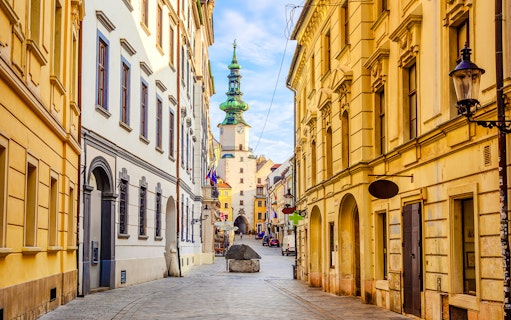 Michael's Gate in Bratislava's Old Town, Slovakia, with historic buildings lining the street.