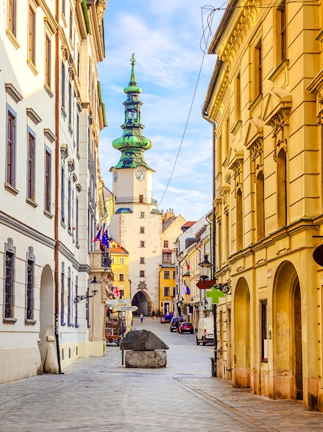 Michael's Gate in Bratislava's Old Town, Slovakia, with historic buildings lining the street.