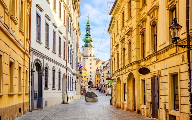 Michael's Gate in Bratislava's Old Town, Slovakia, with historic buildings lining the street.