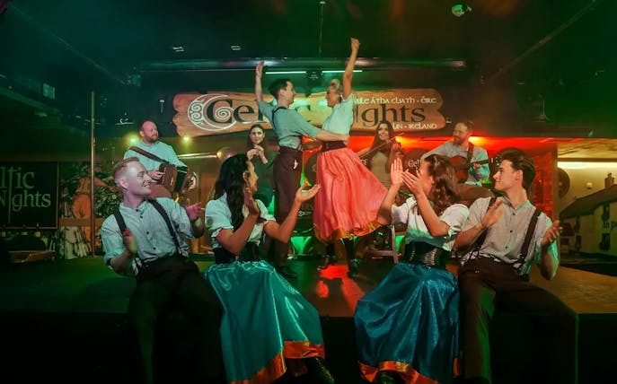 Dancers and musicians performing at Celtic Nights show in Dublin.