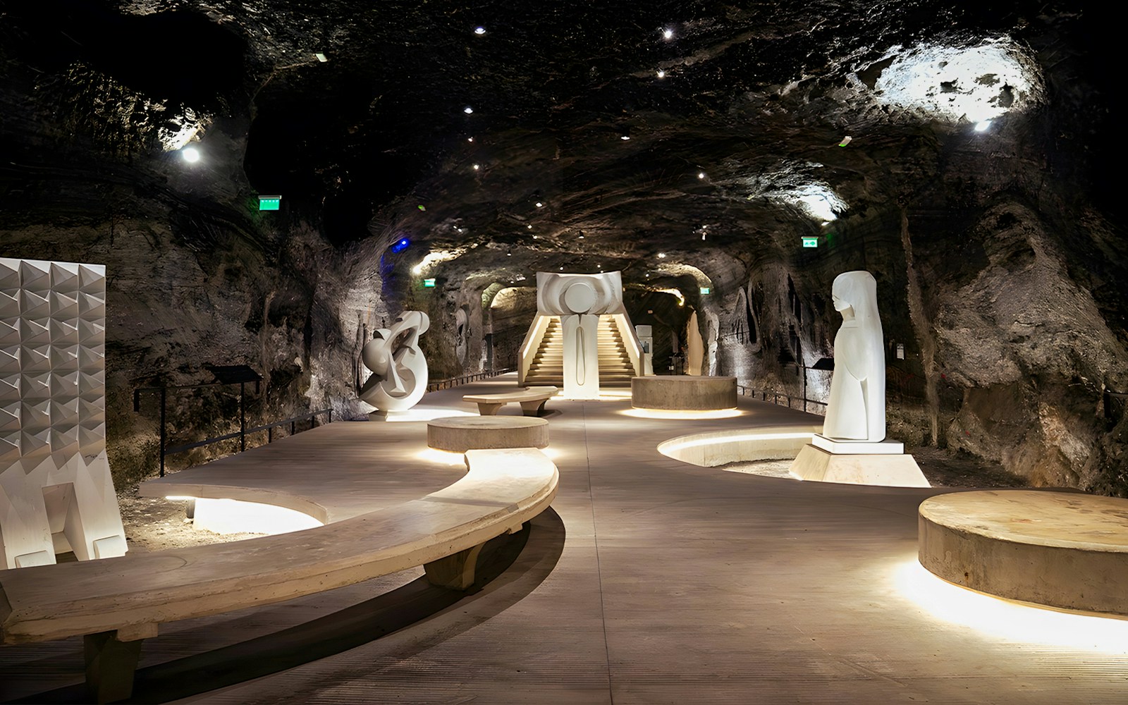 Inside Monumental 180 Museum, Salt Cathedral of Zipaquirá, Colombia, featuring sculptures and illuminated pathways.