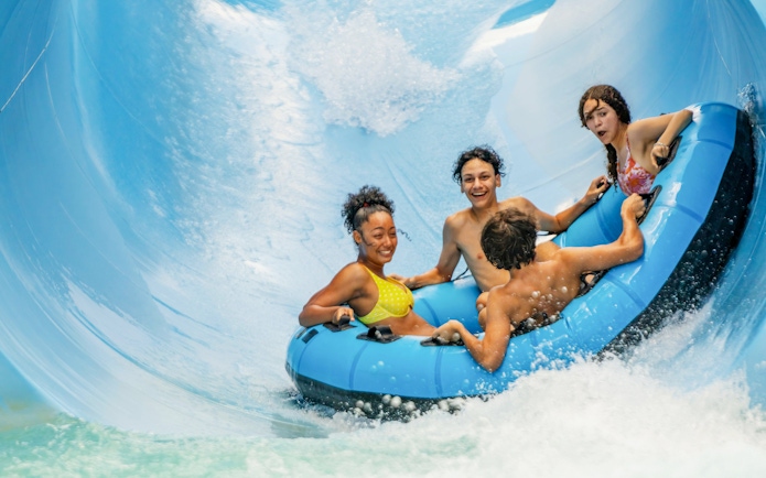 Group enjoying Walhalla Wave water slide at Aquatica Orlando.