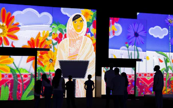 Visitors viewing vibrant digital art at Frameless National Portrait Gallery Exhibition.