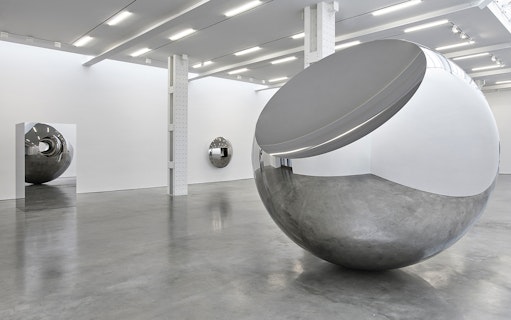 Reflective sculptures in Anish Kapoor's Untrue Unreal exhibition.