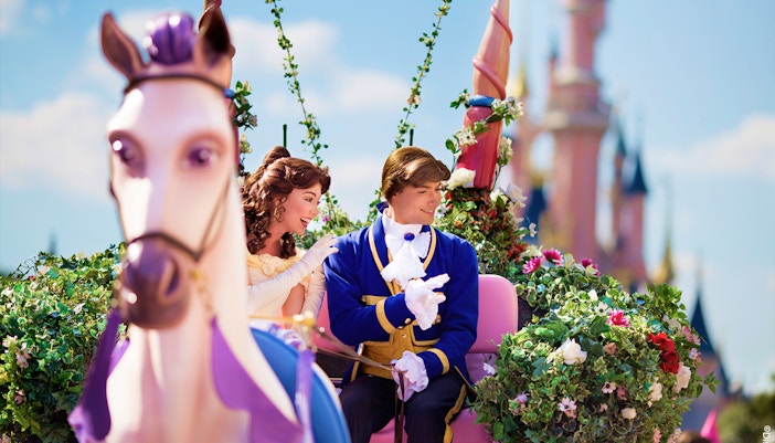 Belle and prince on a floral float during Disneyland Paris parade. - Princess Aurora’s Magical Wishes