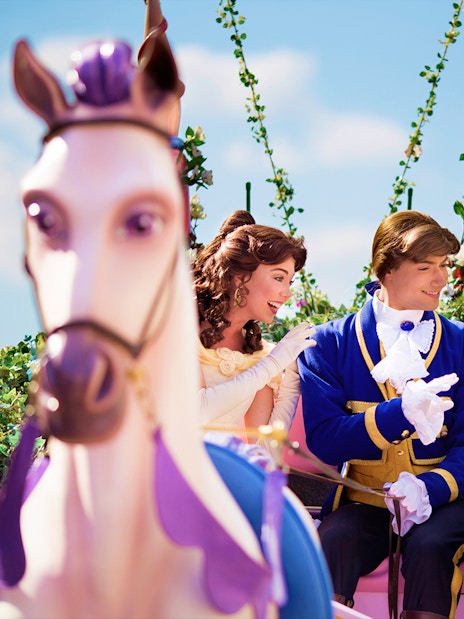 Belle and prince on a floral float during Disneyland Paris parade. - Princess Aurora’s Magical Wishes