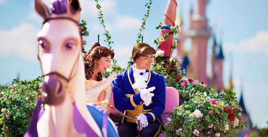 Belle and prince on a floral float during Disneyland Paris parade. - Princess Aurora’s Magical Wishes