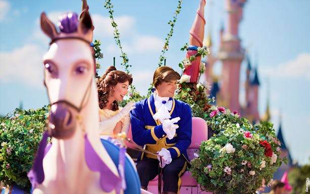 Belle and prince on a floral float during Disneyland Paris parade. - Princess Aurora’s Magical Wishes