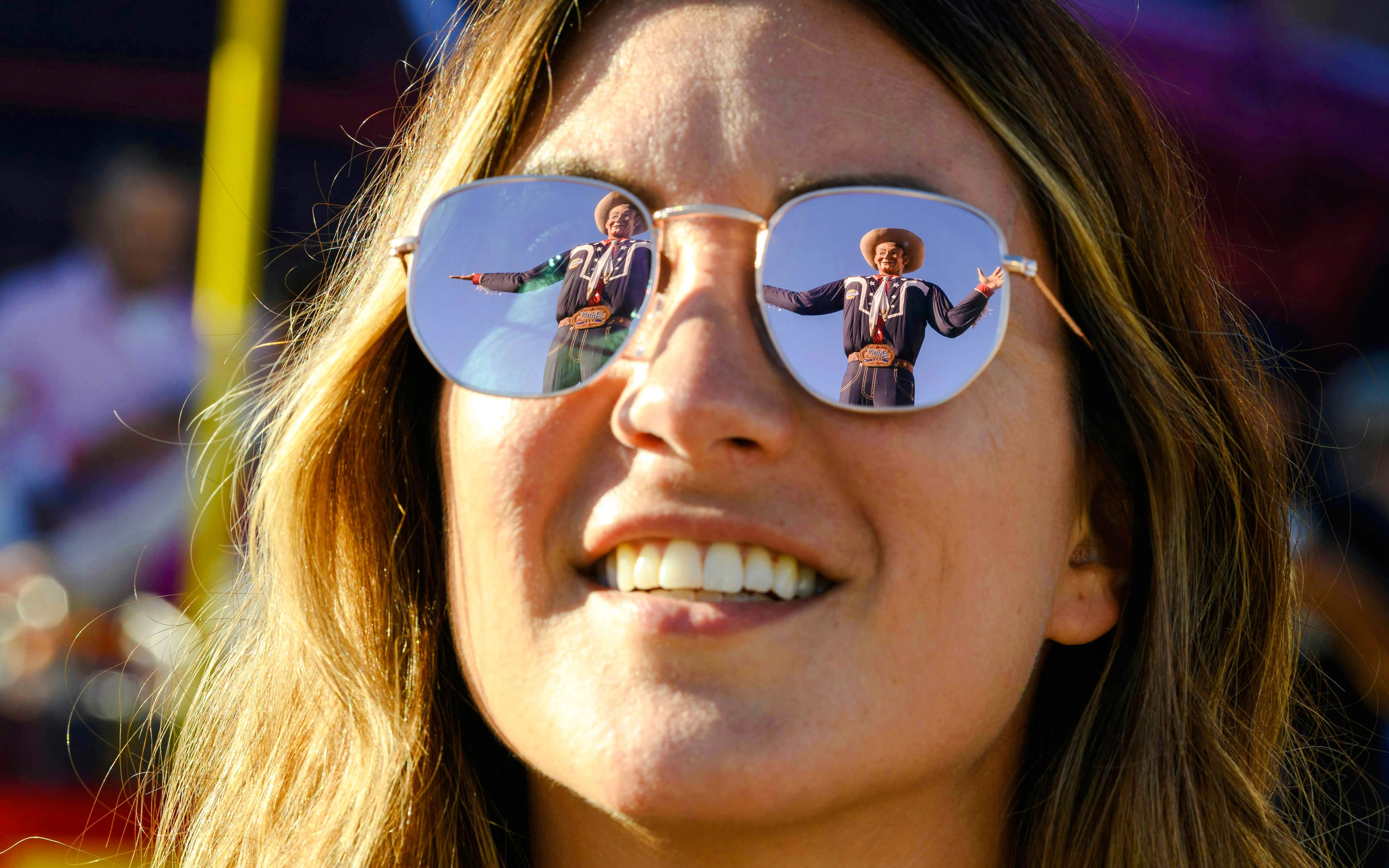 Reflection of Big Tex in sunglasses at the State Fair of Texas.