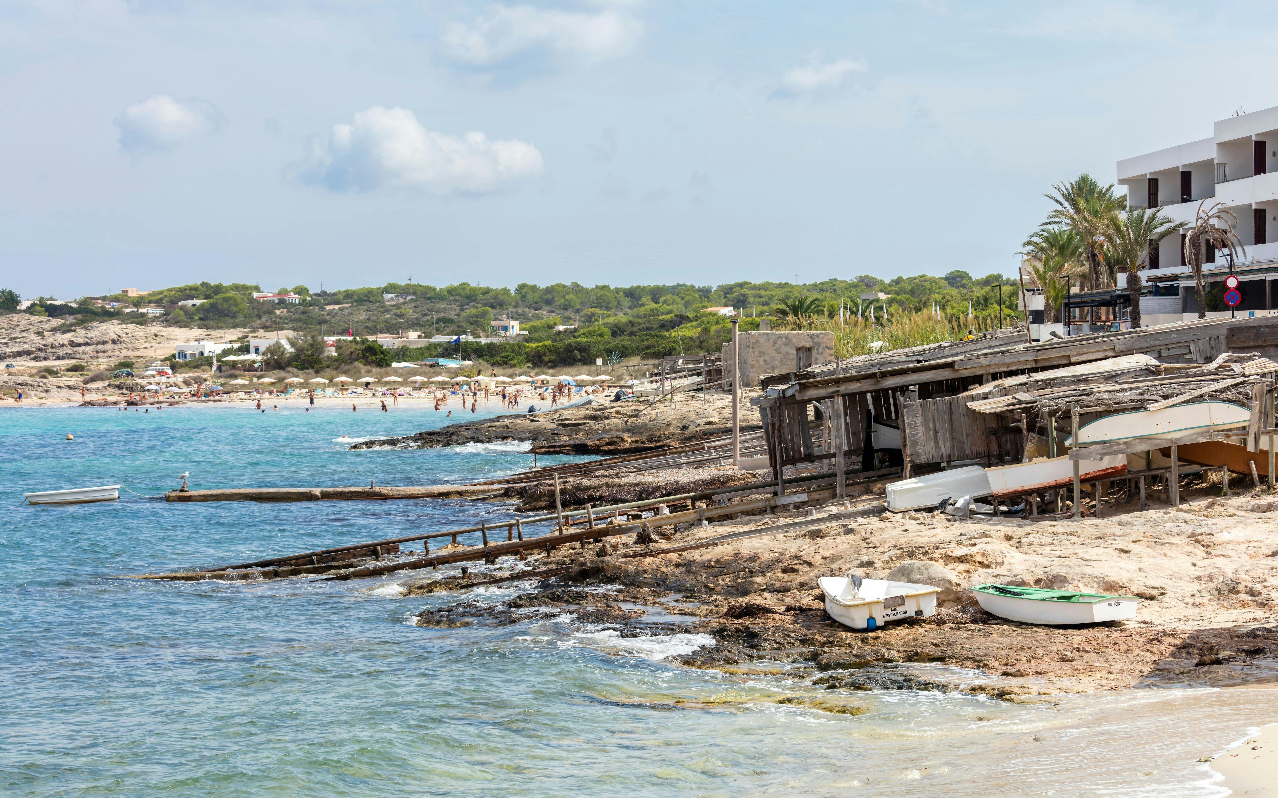 Boats and rustic huts at Es Caló harbour, Formentera, Balearic Islands, Spain.