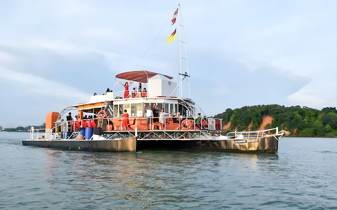 Cruise boat with passengers on Dickson Dragon at Port Dickson, Malaysia.