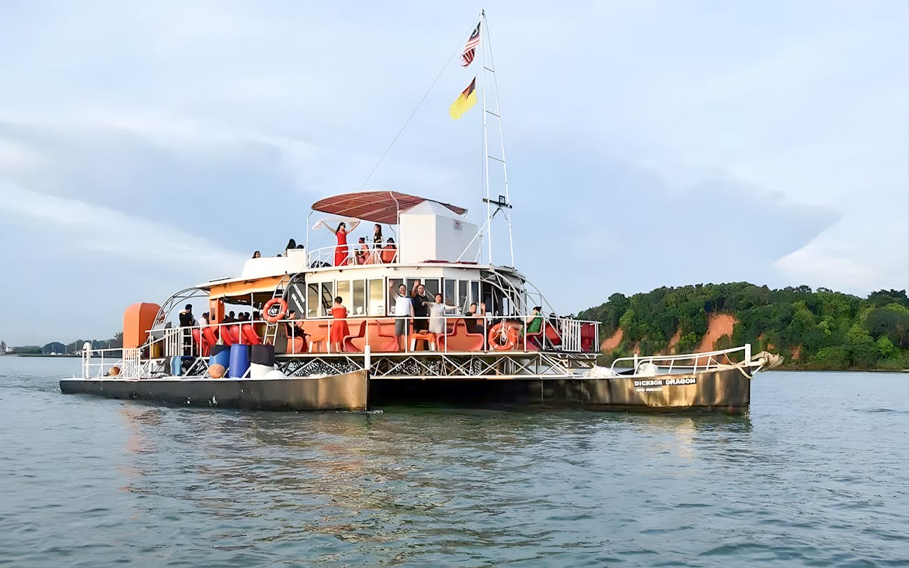 Cruise boat with passengers on Dickson Dragon at Port Dickson, Malaysia.