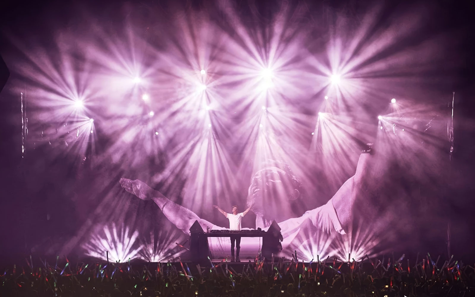 David Guetta performing at F*** ME I'M FAMOUS! in Ushuaia Ibiza with vibrant light show.