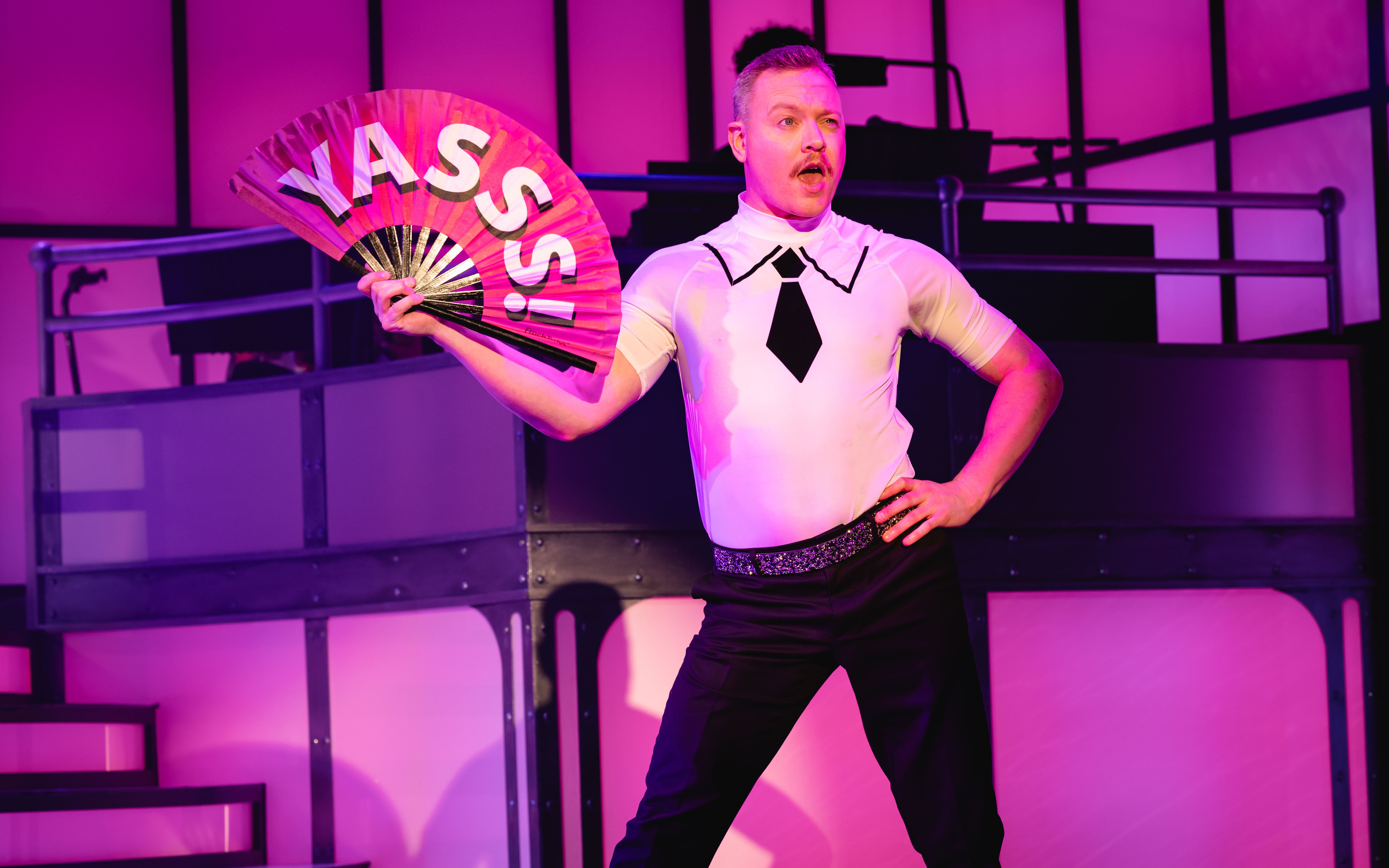 Performer on stage with a fan during Titanique Westend show.