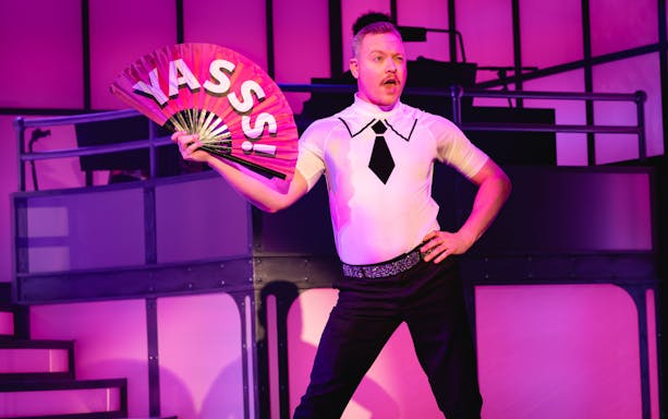 Performer on stage with a fan during Titanique Westend show.