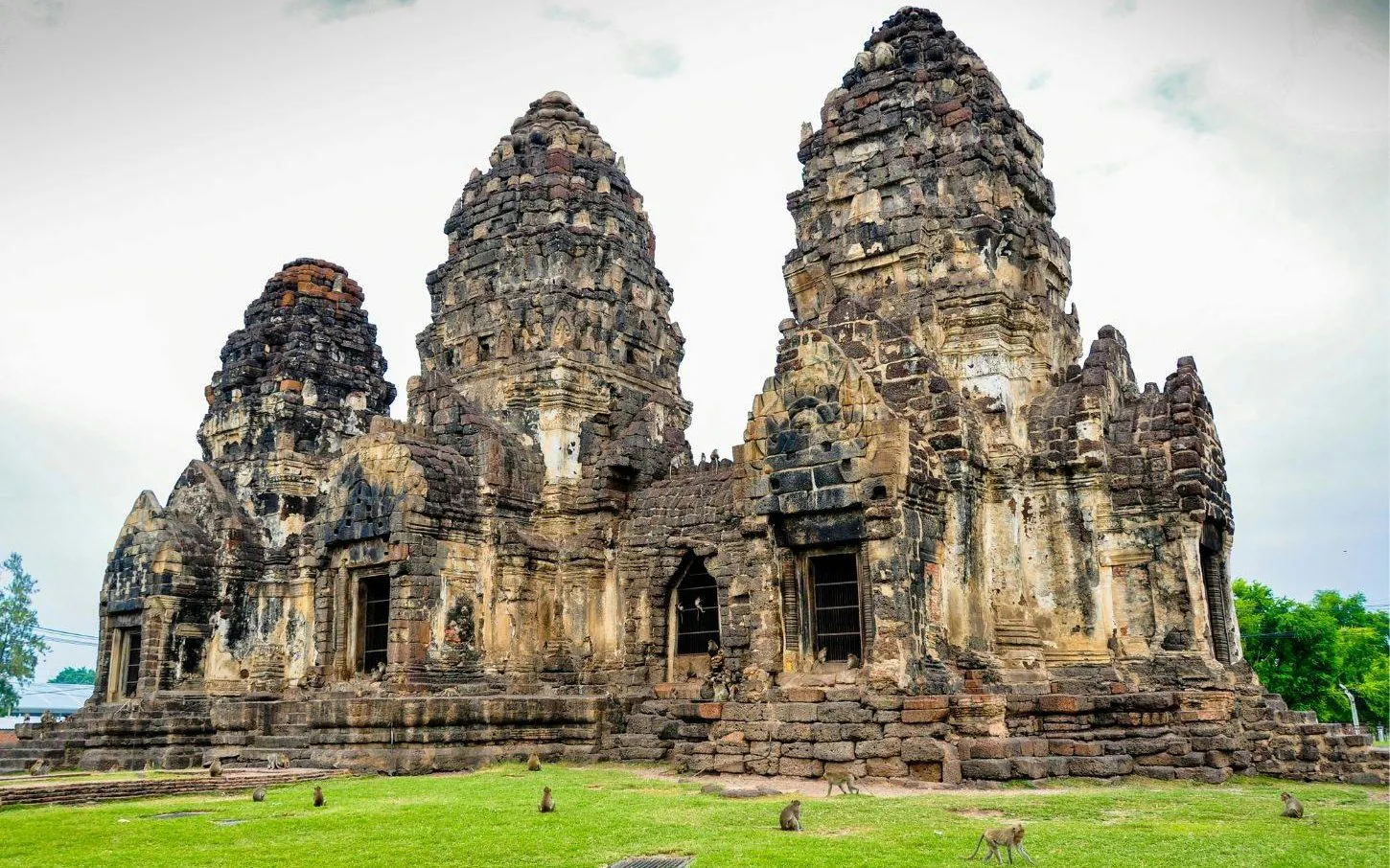 Lopburi Monkey Temple with monkeys on ancient stone ruins, part of Ayutthaya Old City Tour from Bangkok.