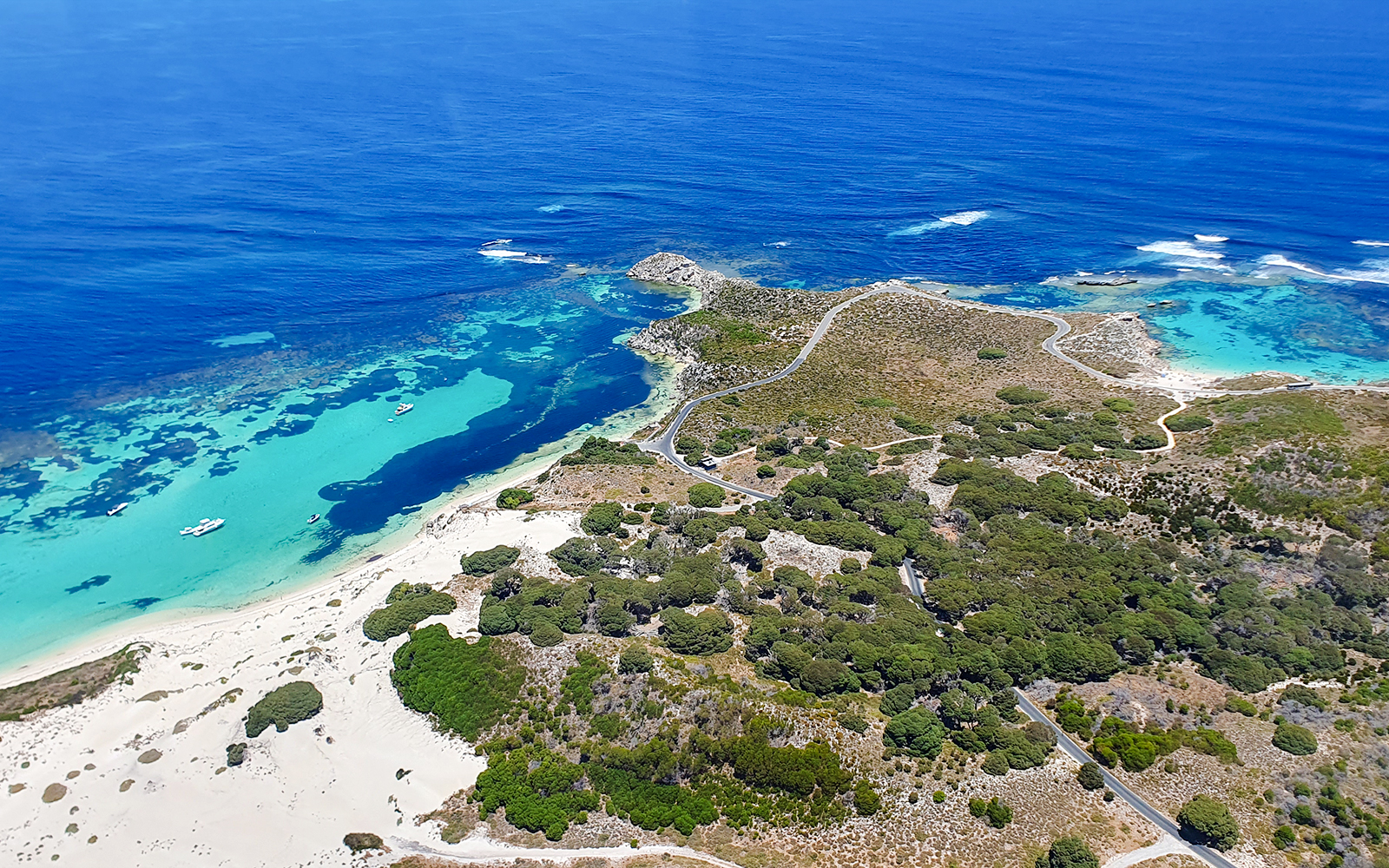Turquoise waters and sandy beaches on Rottnest Island, aerial view.