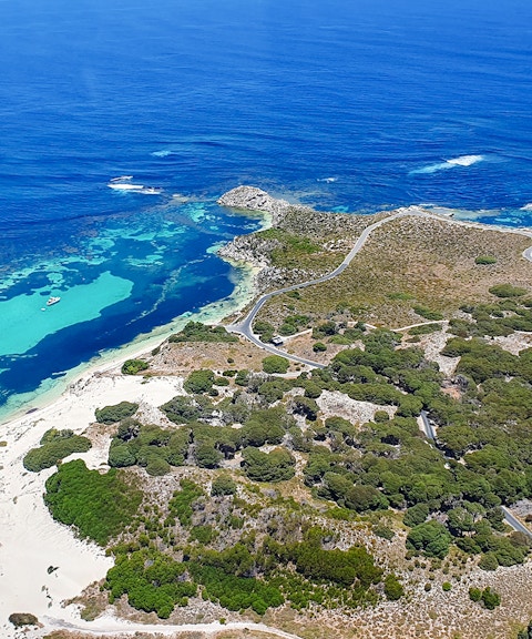 Turquoise waters and sandy beaches on Rottnest Island, aerial view.