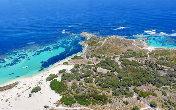 Turquoise waters and sandy beaches on Rottnest Island, aerial view.