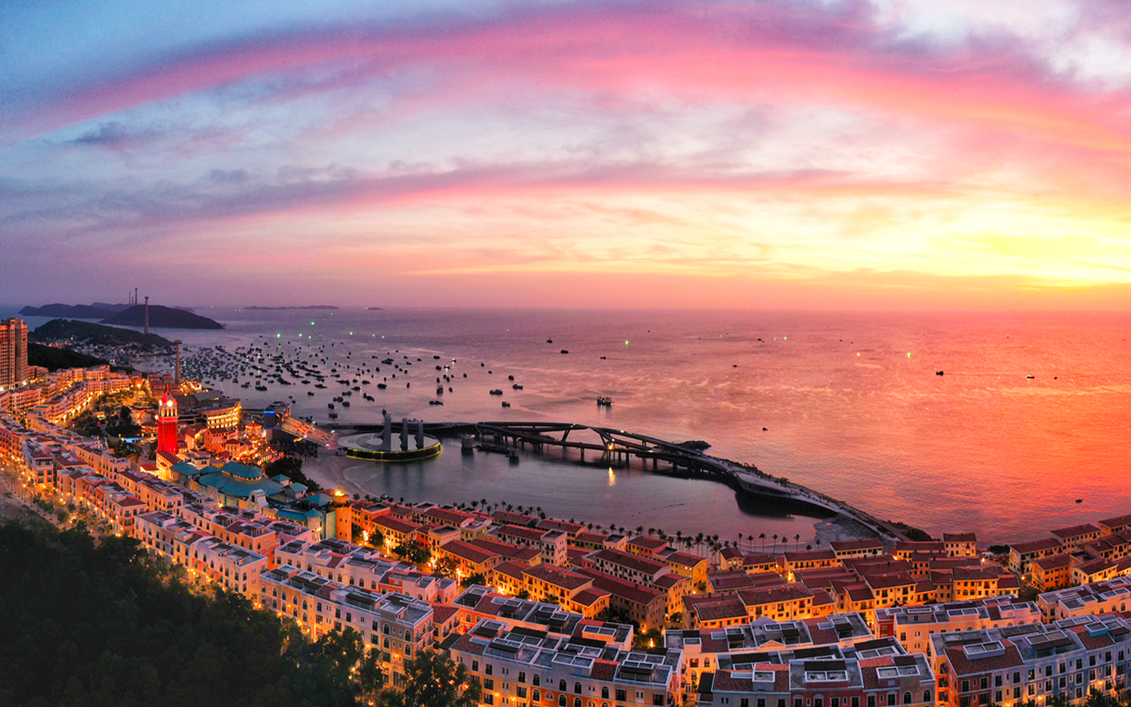Sunset view over Hon Thom island with colorful buildings and boats in Phu Quoc.