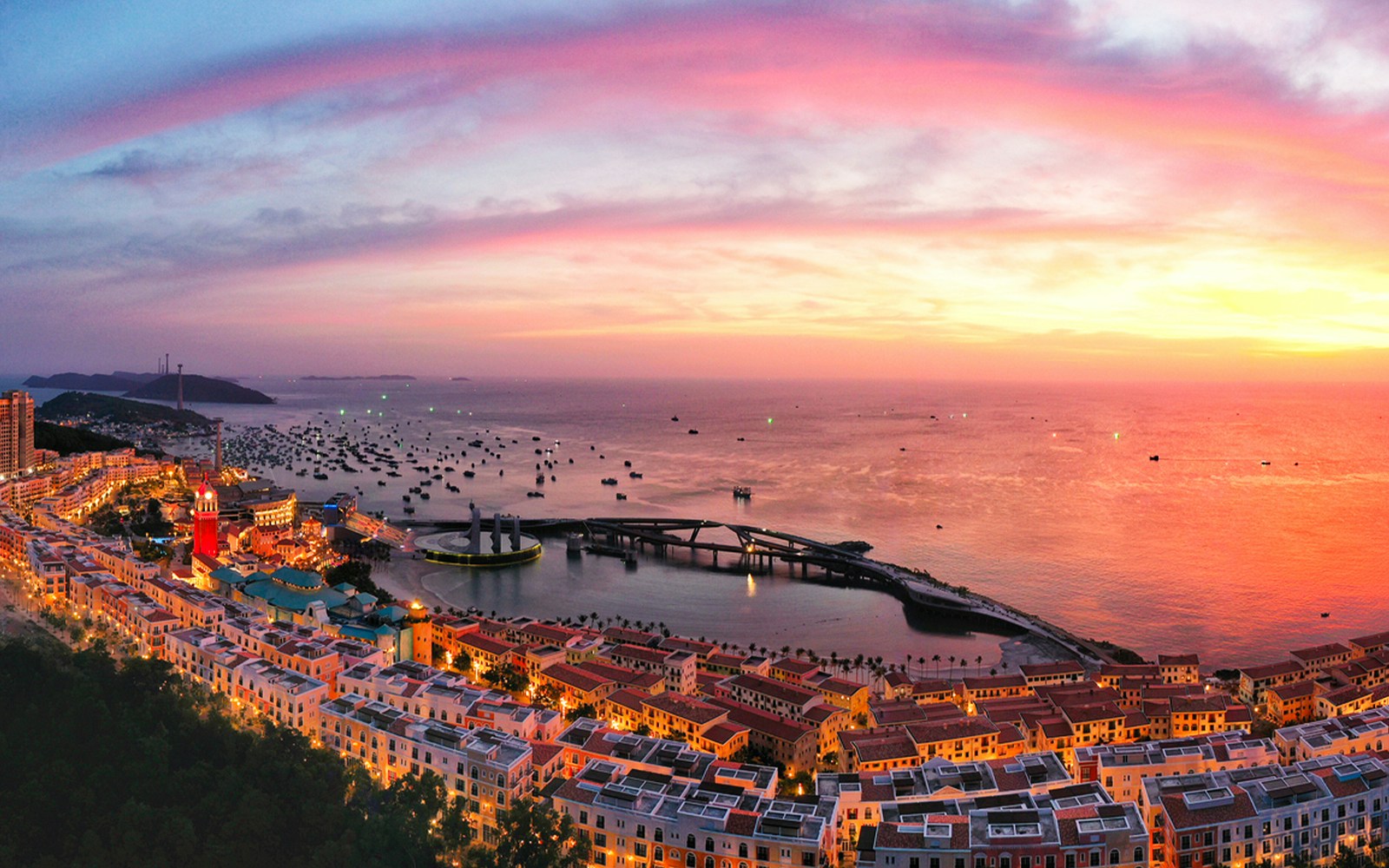 Sunset view over Hon Thom island with colorful buildings and boats in Phu Quoc.
