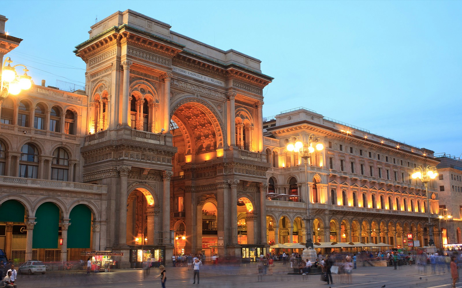 Galleria Vittorio Emanuele II illuminated at dusk in Milan, Italy.