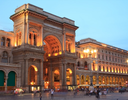 Galleria Vittorio Emanuele II interior with glass dome and ornate architecture in Milan, Italy.