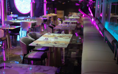 Luxurious dining setup on Super Galaxy Chao Phraya River Dinner Cruise, Bangkok.