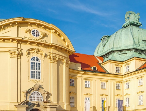 Klosterneuburg Monastery's baroque architecture in Vienna, Austria, under a clear blue sky.