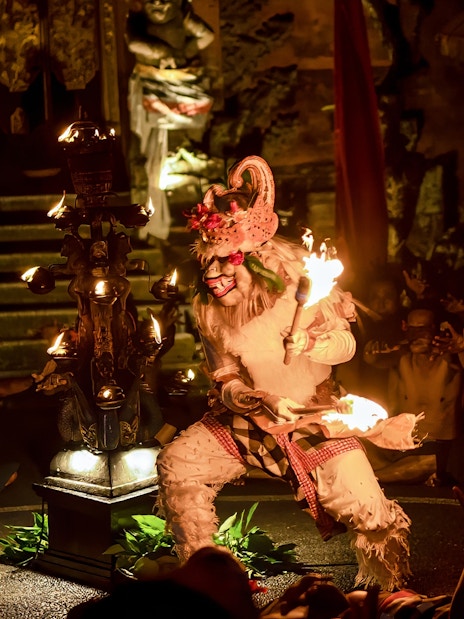Performer in traditional costume at Kecak & Fire Dance, Ubud Peliatan Palace.