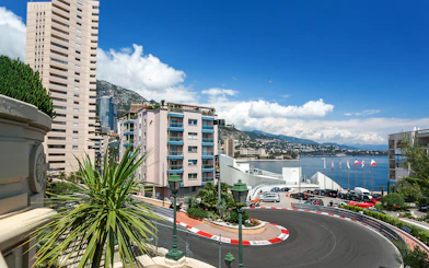Monte Carlo F1 circuit with cityscape and harbor in Monaco.