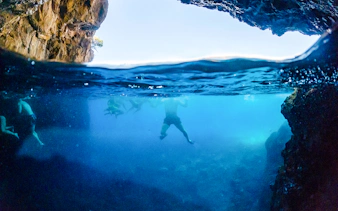 Swimming near blue caves in Dubrovnik, Croatia.